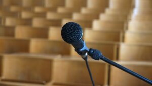 Microphone in front of empty rows of chairs
